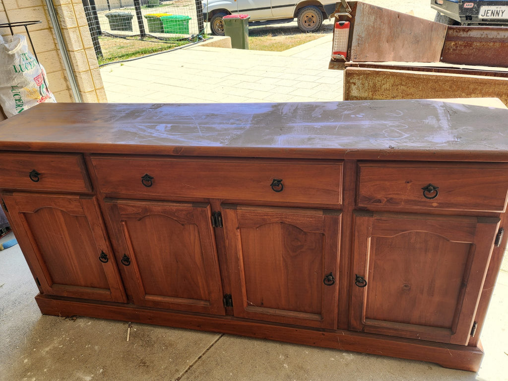 An upcycled buffet using Target placemats in the doors!