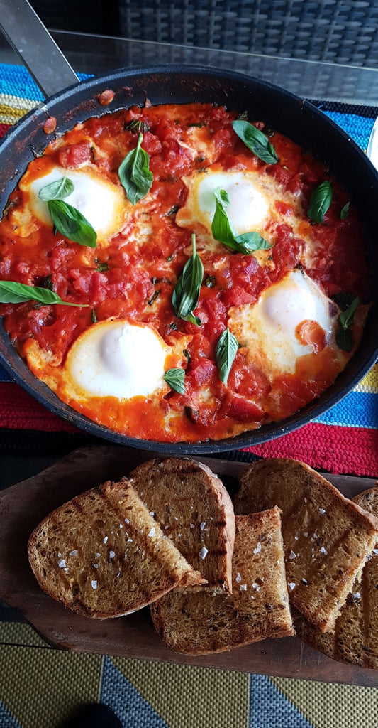 Tomato and mozzarella baked eggs