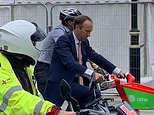 Matt Hancock is seen Boris-biking it through London while Cabinet reshuffle happens